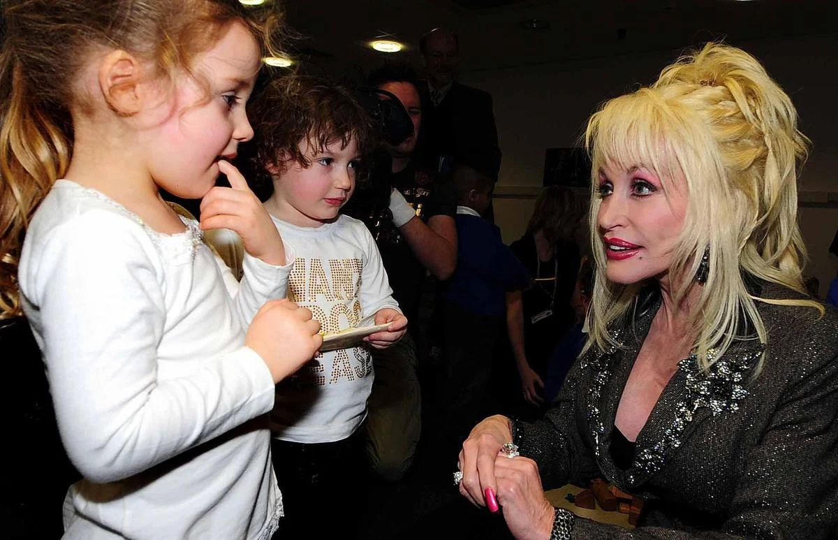 The Literacy of Love: Dolly Parton’s Radical Legacy of Global Philanthropy